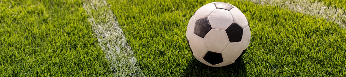soccer ball on grass corner kick